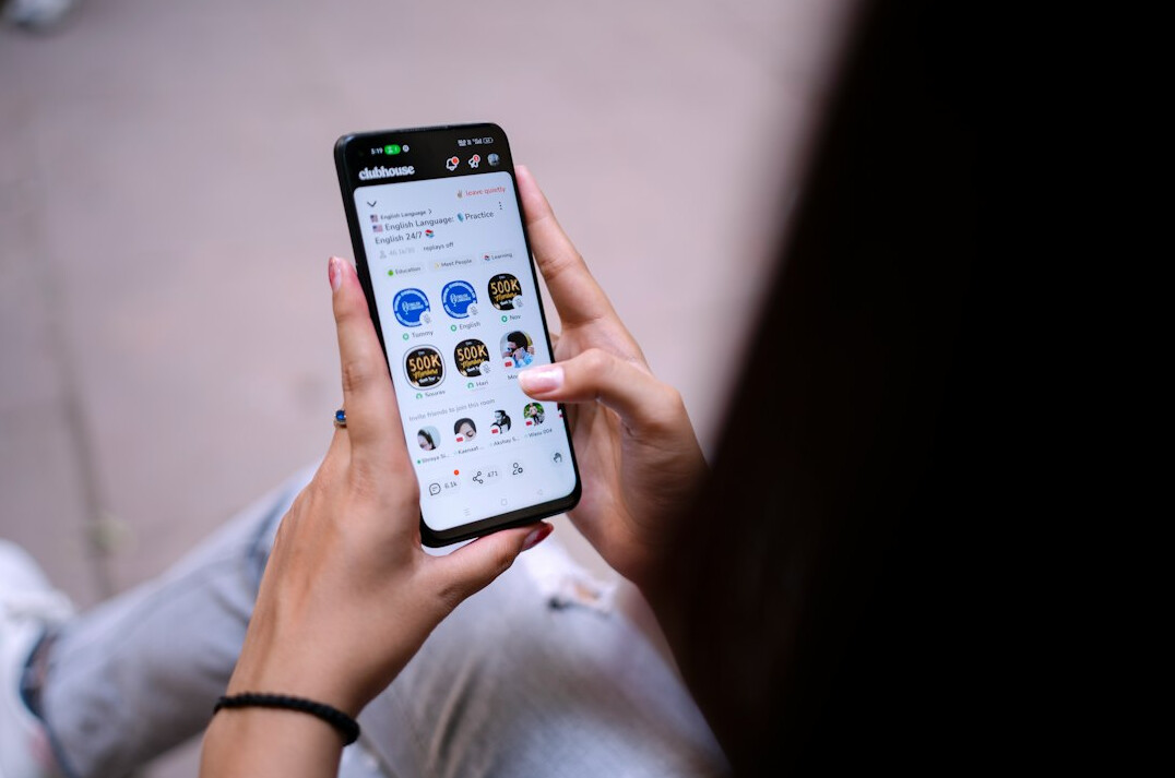 person scrolling on smartphone