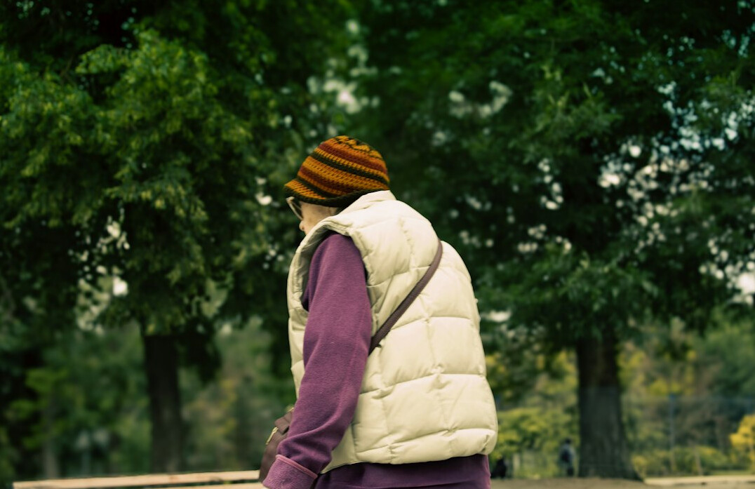 person walking alone in park