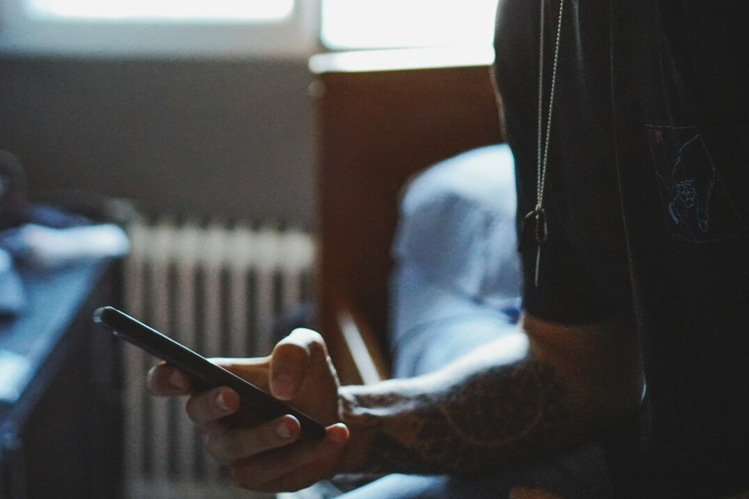 young adult using smartphone