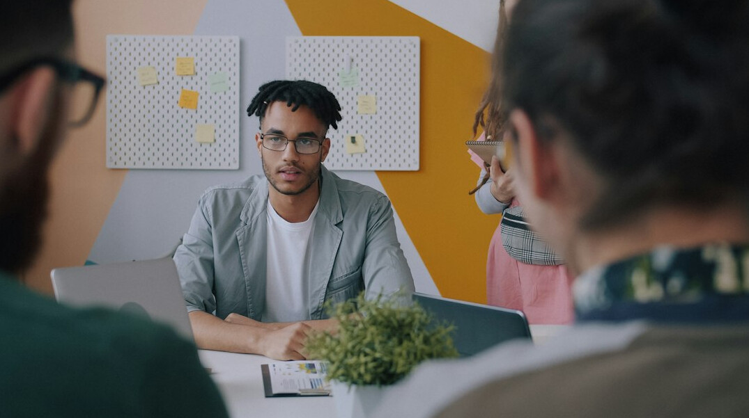 young adults discussing in group